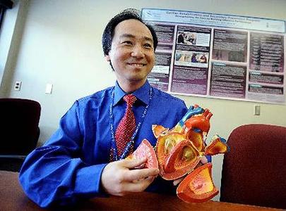 Toronto Rehabilitation Hospital's Dr. Paul Oh, holding a model of a heart, notes that this muscle needs maintenance, just like a house does.