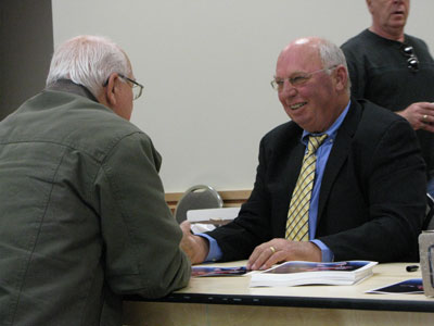 Dennis Signing Autographs