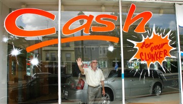In this Aug. 11, 2009 photo, Greg Signore, owner of Elm Auto Sales, is pictured at his used car business in Kearny, N.J. Under Cash for Clunkers, old gas guzzlers turned at the new-car dealership are rendered inoperable and towed to the salvage yard. By some estimates, three of every five of those cars would have normally gone to a used-car lot for resale.
