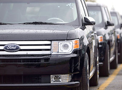 Ford Flex crossover vehicles sit in parking lots outside the production facility in Oakville, Ont. 