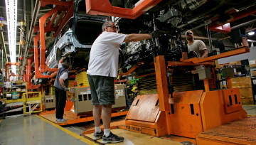Ford employees work on an assembly line in Oakville, Ont. Simon Hayter/Getty Images