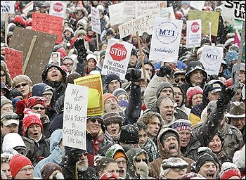 Opponents to the governor's bill to eliminate collective bargaining rights for many state workers protest outside of the state Capitol in Madison, Wis., Saturday, Feb. 26, 2011. Union supporters are on 12th day of protests at the Capitol. (AP Photo/Andy Manis) (Andy Manis - AP) 