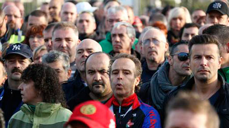 Workers gather outside the Genk plant