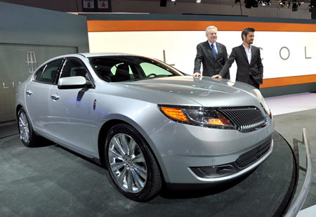 Lincoln Chief Designer Max Wolff, right, and Derrick Kuzak, group vice president of global product development, reveal the 2013 Lincoln MKS at the Los Angeles Auto Show on Nov. 17, 2011. (Lincoln)