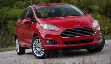 The 2014 Fiesta sports a new grille, hood and tapered lines. It will also offer a 3-cylinder engine. (Ford)
