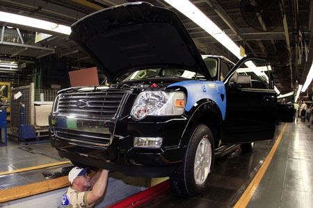 A worker assembles a Ford Motor Co. Explorer sport utility vehicle (SUV) at the company's Louisville Assembly Plant in Kentucky. Photographer: John Sommers II/Bloomberg 