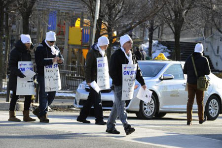 Striking workers, who fuel planes for Porter Fixed Base Operations, a subsidiary of Porter Aviation Holdings Inc., picket at Queens Quay and Bathurst St. on Jan. 10. 
