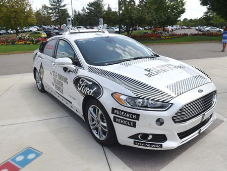 The new test vehicle is painted to look like a test vehicle, with notices saying as much printed on the doors and hood of the car.