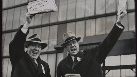 Raising funds for Christmas baskets for needy Windsor families Roy England, left, President of the Ford local of the United Automobile Workers Union, and Rhys M. Sale, Ford of Canada President, sell Christmas editions of the Goodfellows Club newspaper outside the factory. The club sponsors the campaign. (The Canadian Press)