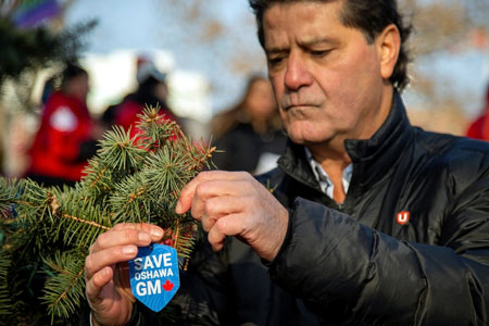 Jerry Dias helps launch the Unifor #SaveOshawaGM campaign by unveiling its Tree of Hope in Memorial Park in Oshawa, Ont., last week