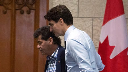 Prime Minister Justin Trudeau and Unifor National President Jerry Dias make their way to a meeting on Parliament Hill in Ottawa on Tuesday, November 27, 2018. Dias said Trudeau has not accepted GM's Oshawa closure as a 'fait accompli.' (Fred Chartrand/Canadian Press)