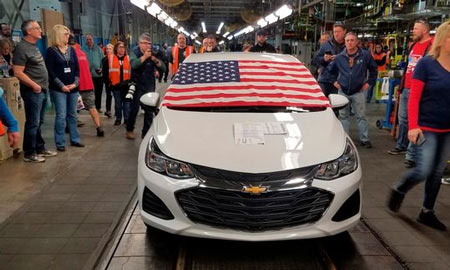 An American flag drapes the hood of the last Chevrolet Cruze as it comes off the assembly line at a General Motors plant where 1,700 hourly positions are being eliminated perhaps for good, on Wednesday, March 6, 2019, in Lordstown, Ohio. The factory near Youngstown is the first of five North American auto plants that GM plans to shut down by next year. (Photo: AP