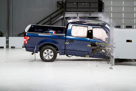 Action shot taken during the passenger-side small overlap frontal crash test of the 2019 Ford F-150 SuperCrew. (Photo: IIHS)