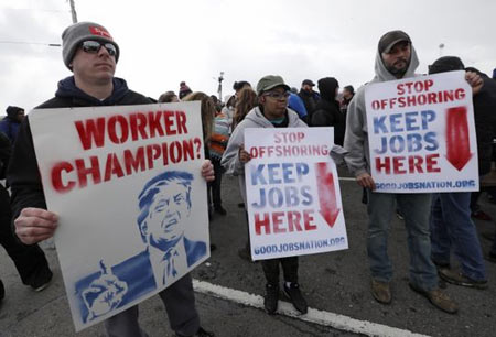 Workers protest March 6 outside GM's Lordstown, Ohio, plant, the last day of production at the factory. President Trump unleashed a Twitter storm about the plant before a Wednesday rally in Ohio. (Photo: Tony Dejak, AP)
