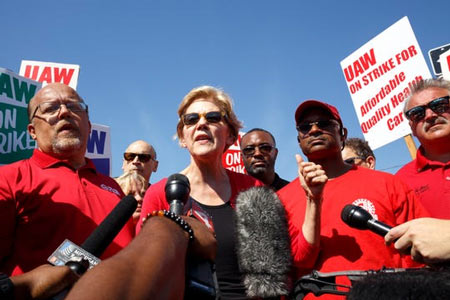 Senator Elizabeth Warren talks with members of the press after walking with GM UAW members and supporters on the picket line at the Detroit-Hamtramck assembly plant on day seven of the labor dispute strike on Sunday, Sept. 22, 2019 in Hamtramck.  (Photo: Elaine Cromie, Special to the Detroit News)