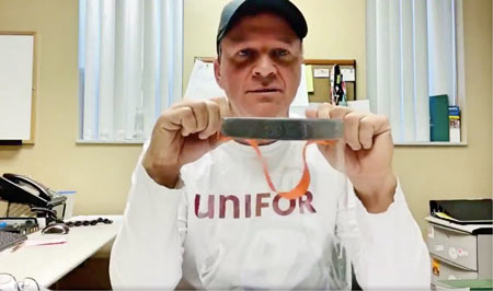 Unifor Local 200 President John D'Agnolo displays one of the face shields his members are making Ford's engine plant in Windsor, Ont.