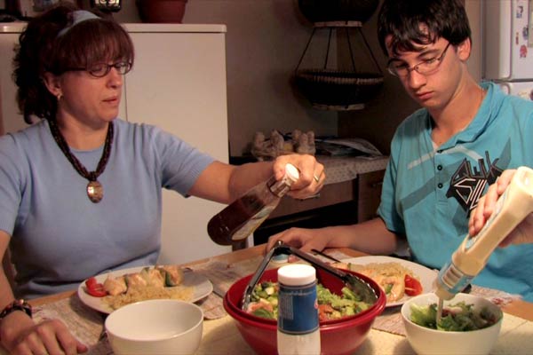 France Savoie checks out salad dressings at dinner with her 16-year-old son David Beeching, a rock-guitar enthusiast who was diagnosed with high blood pressure at 13. 