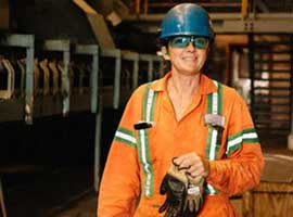 Worker wearing hard hat and safety glasses