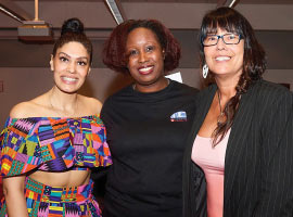 Three women posing for a photo.