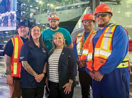People standing inside the Halifax Shipyard
